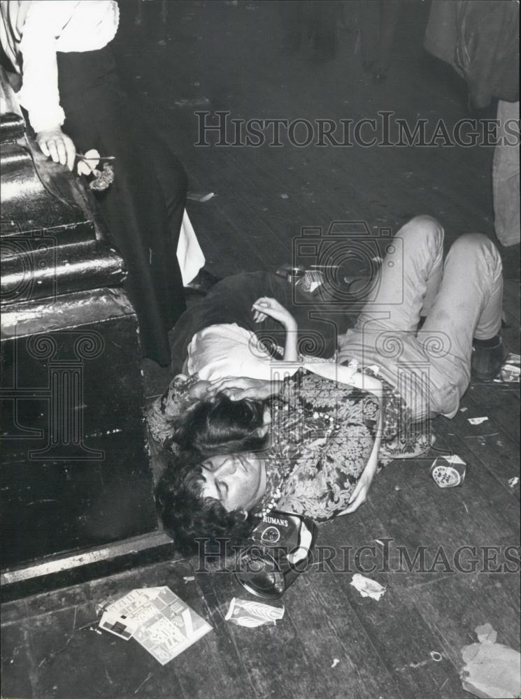 Press Photo Lying on the Floor - Historic Images