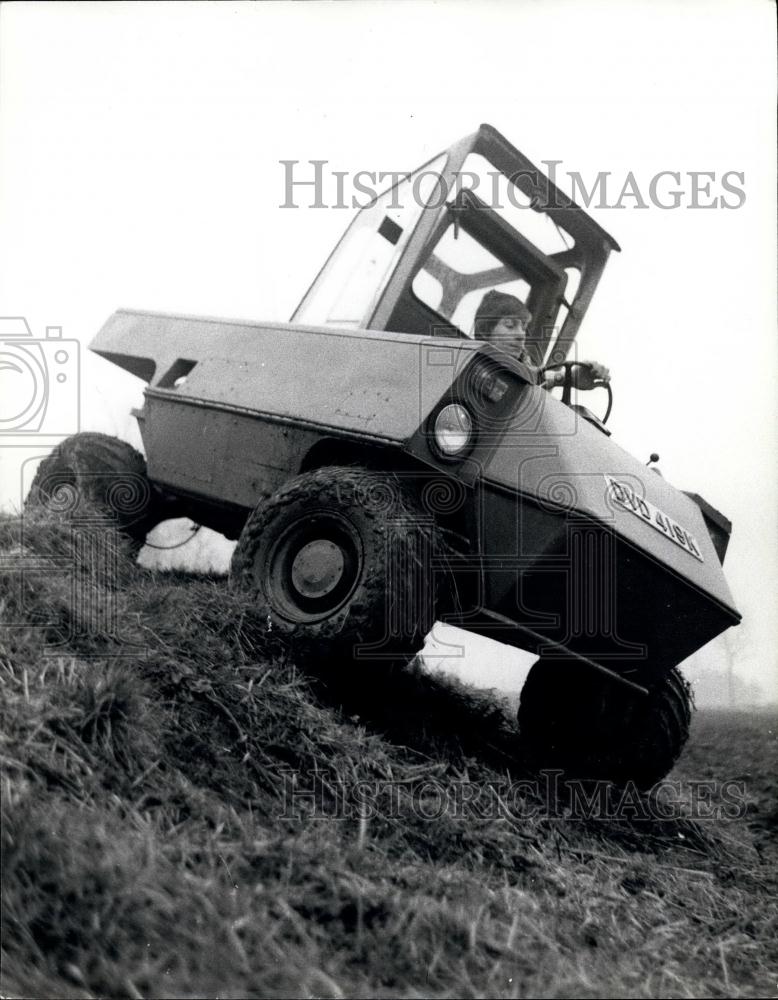 Press Photo Hugh in his wildcat vehicle on the farm - Historic Images