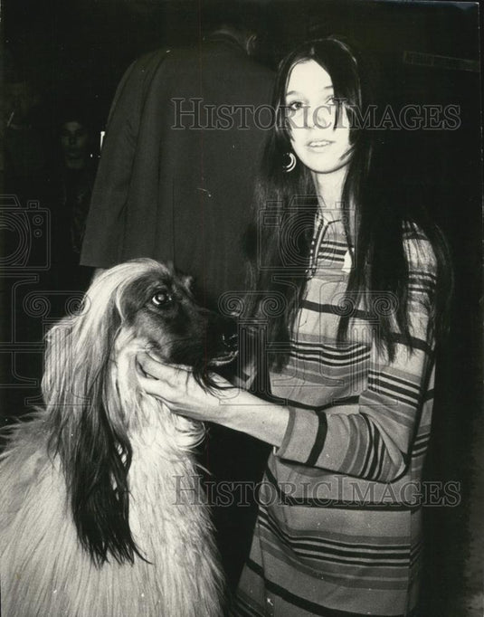 Press Photo A Young Woman Holds A Dog - Historic Images