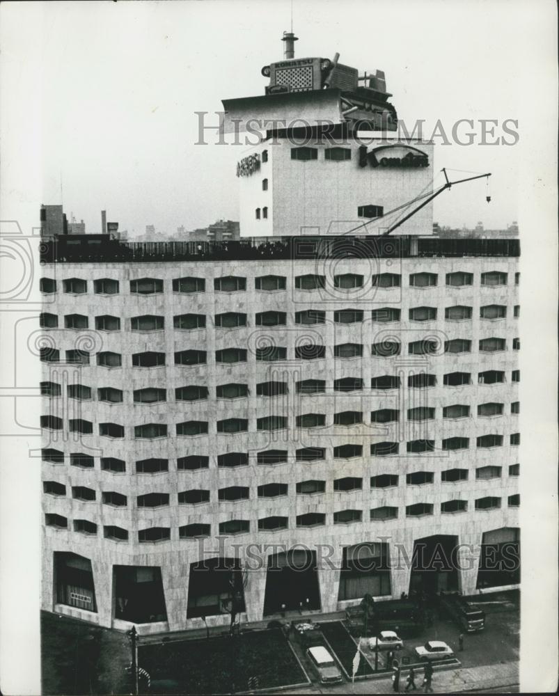 Press Photo Bulldozer atop building in Toyko - Historic Images