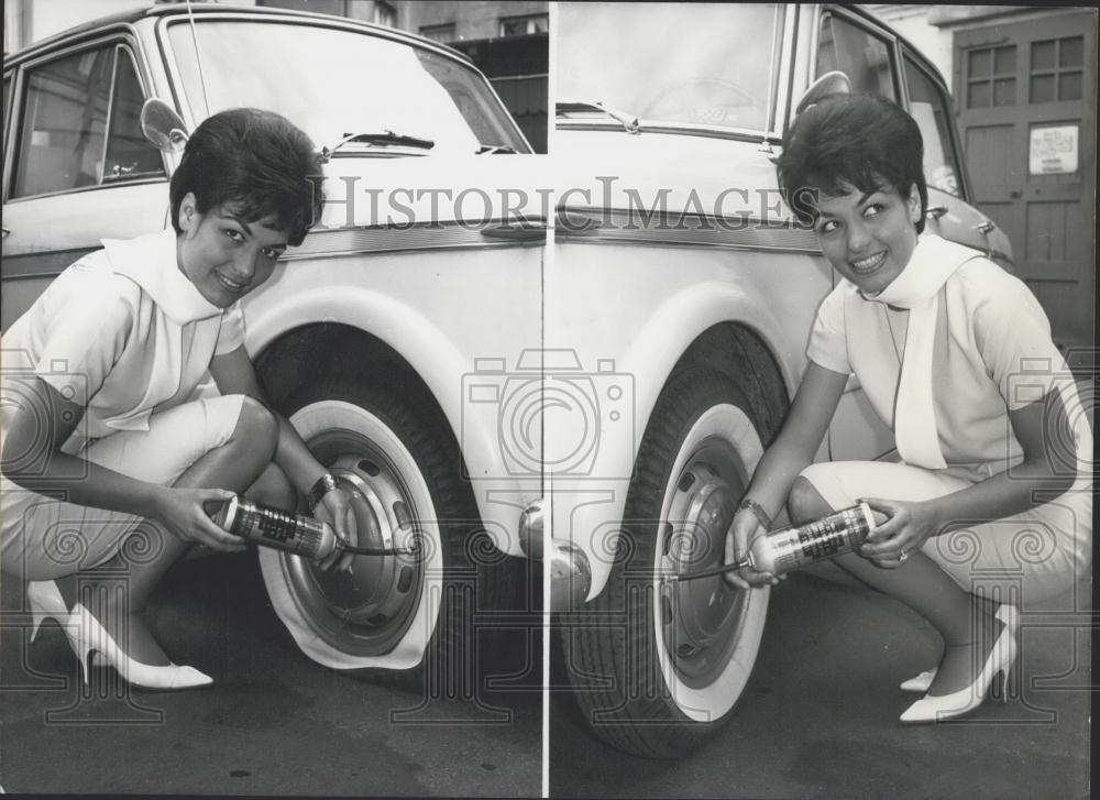 1961 Press Photo Flat Tyres - filled again within seconds - Historic Images