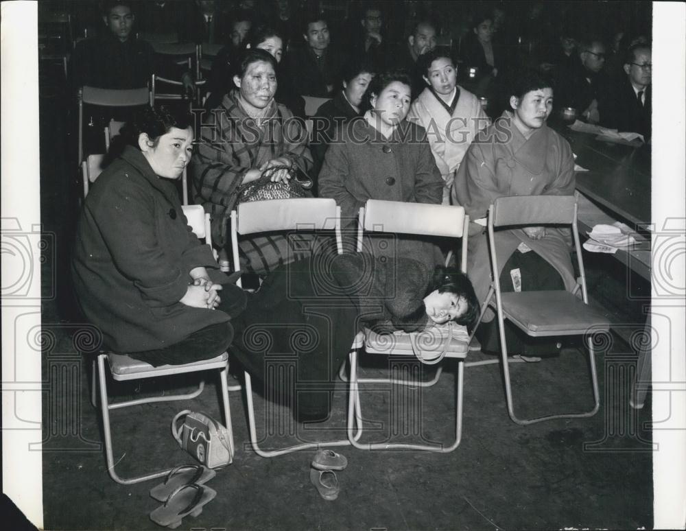 Press Photo Woman listening to the speeches of protest - Historic Images