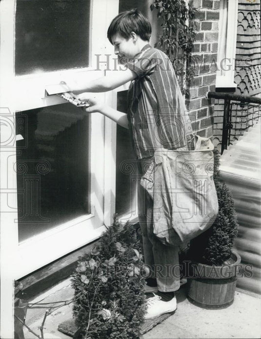 Press Photo Christopher Does Odd Jobs to Pay for Flying Lessons - Historic Images