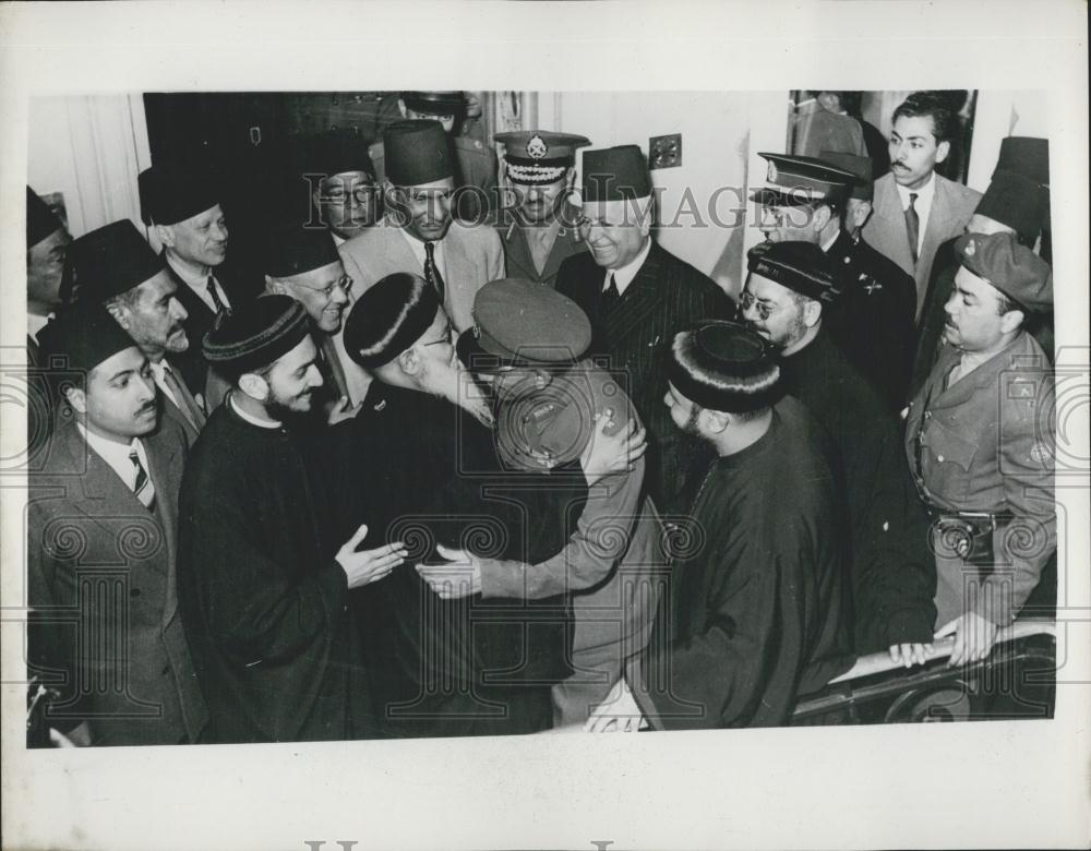 1953 Press Photo of Egyptian PM Neguib kissing Coptic patriarch in Cairo - Historic Images