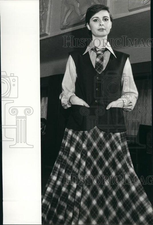 Press Photo Model Wearing Plaid Skirt With Matching Tie Dark Vest - Historic Images