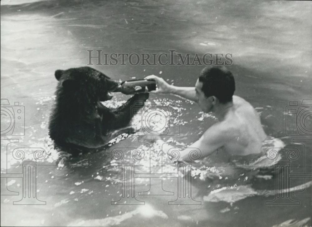 Press Photo Japanese bather and a young bear - Historic Images