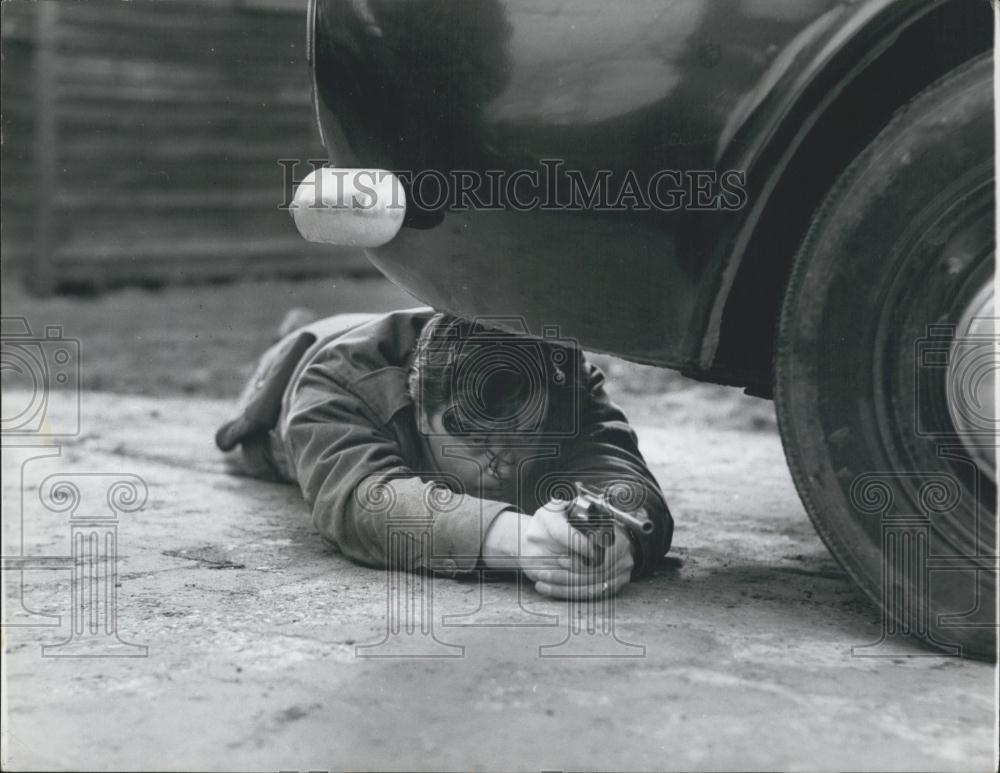 Press Photo P.C. Cheal Takes Cover Underneath Car Training Excercises - Historic Images