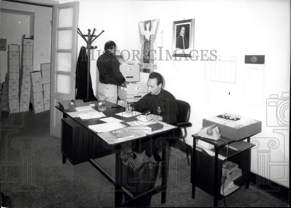 1974 Press Photo Preparations for the Holy Year in Rome Priest at Desk - Historic Images