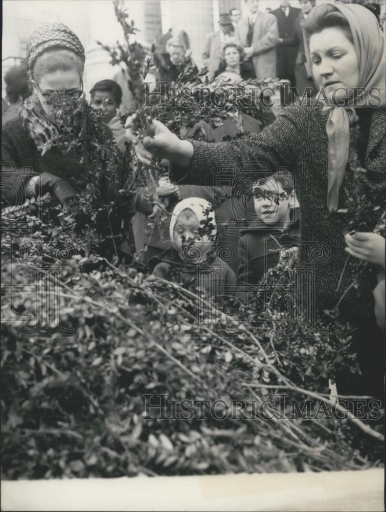 1966 Press Photo People Place Boxwood Bouquets at the Madeleine Church - Historic Images