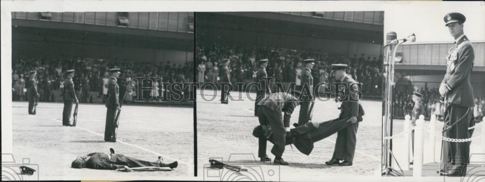 1955 Press Photo British Soldier Faints at Parade in Oldenburg. - Historic Images