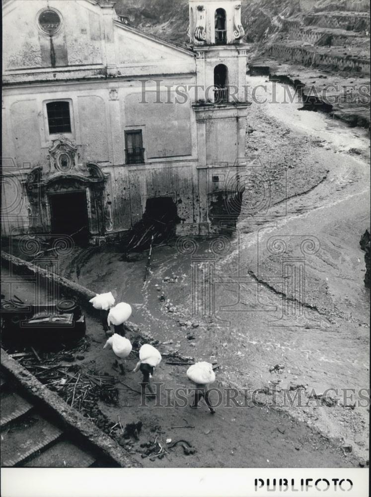 Press Photo Rebuilding and Cleaning after a Landslide in Molina - Historic Images