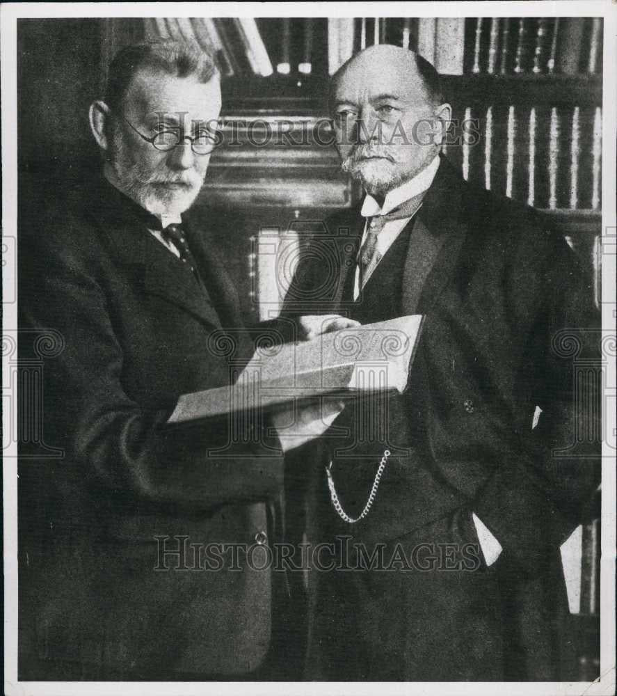 Press Photo Mr Paul Egvlig and Emil Begving with a book - Historic Images