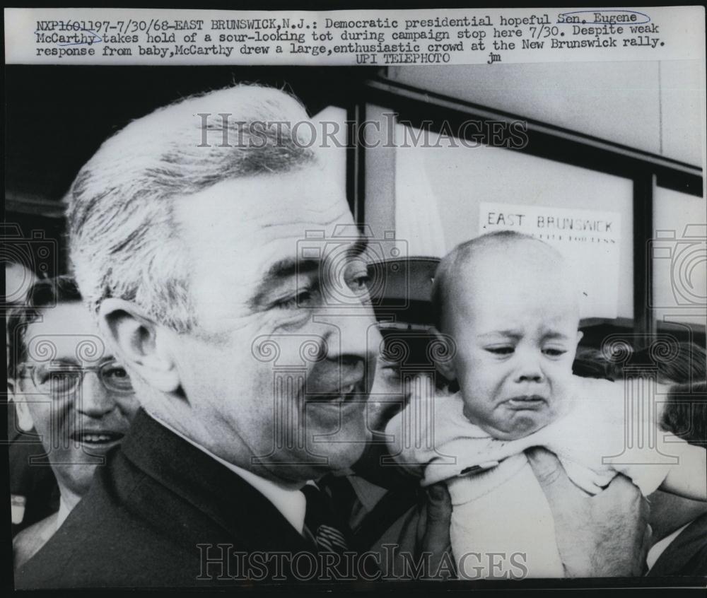 1968 Press Photo SenEugene McCarthy hold a baby during campaign in Brunswick NJ - Historic Images