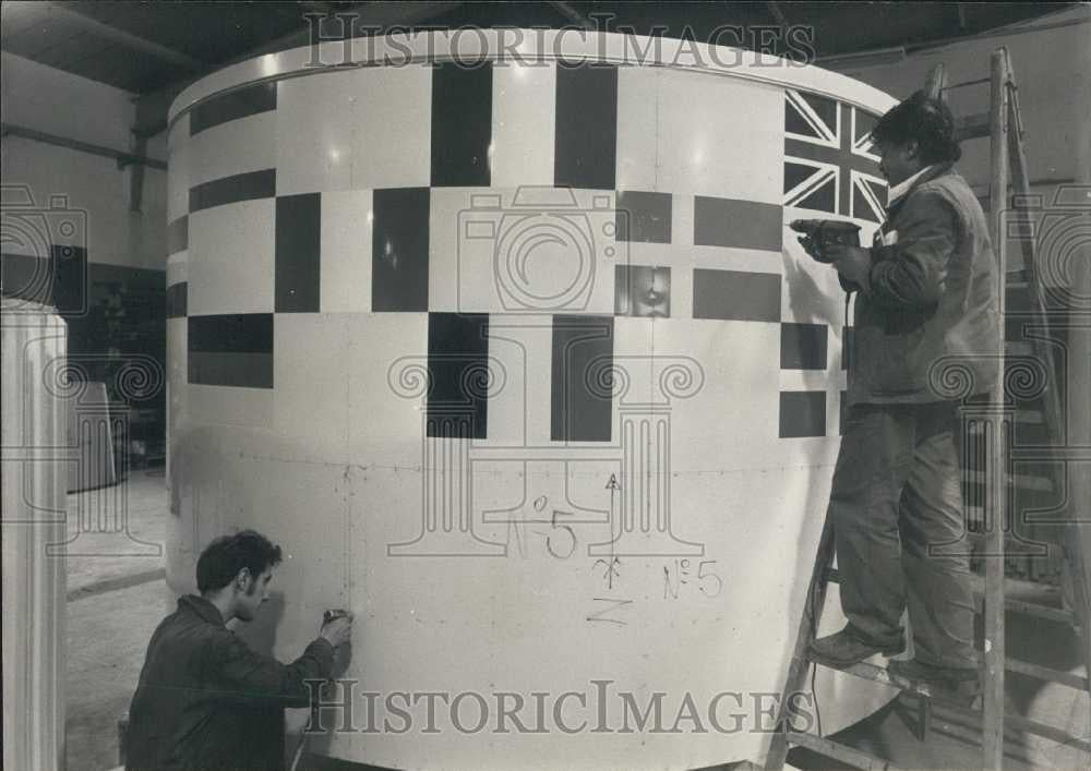 1957 Press Photo Workers set up French &quot;Ariane&quot; rocket on display - Historic Images