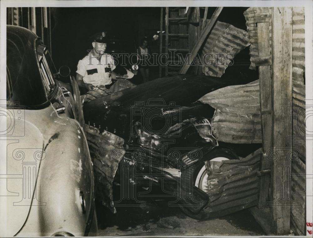 1960 Press Photo Patrolman Monroe Miller Looking at Car Accident - RSL98713 - Historic Images