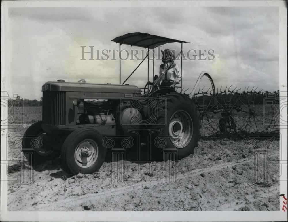 Press Photo Farmer Working out in the field on a Tractor - RSL97609 - Historic Images