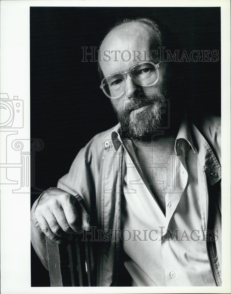 1987 Press Photo Graham Reid Theater Director seated on chair - RSL04289 - Historic Images