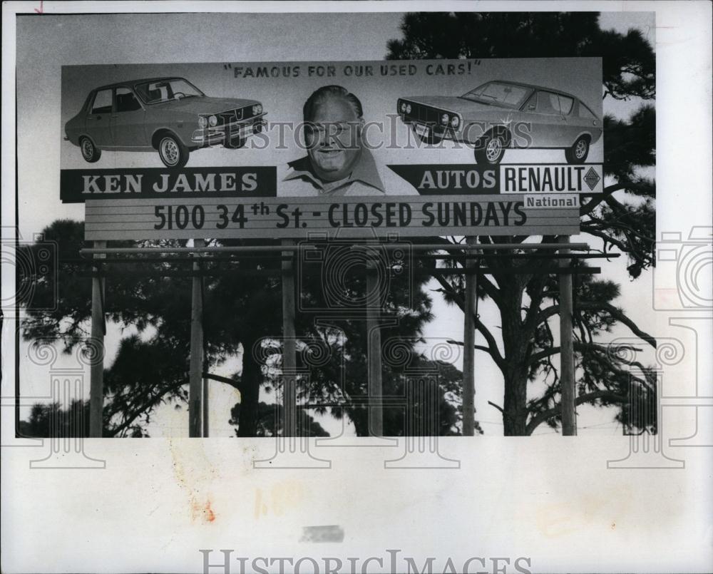 1974 Press Photo Ken James on his auto sales billboard in Florida - RSL95497 - Historic Images