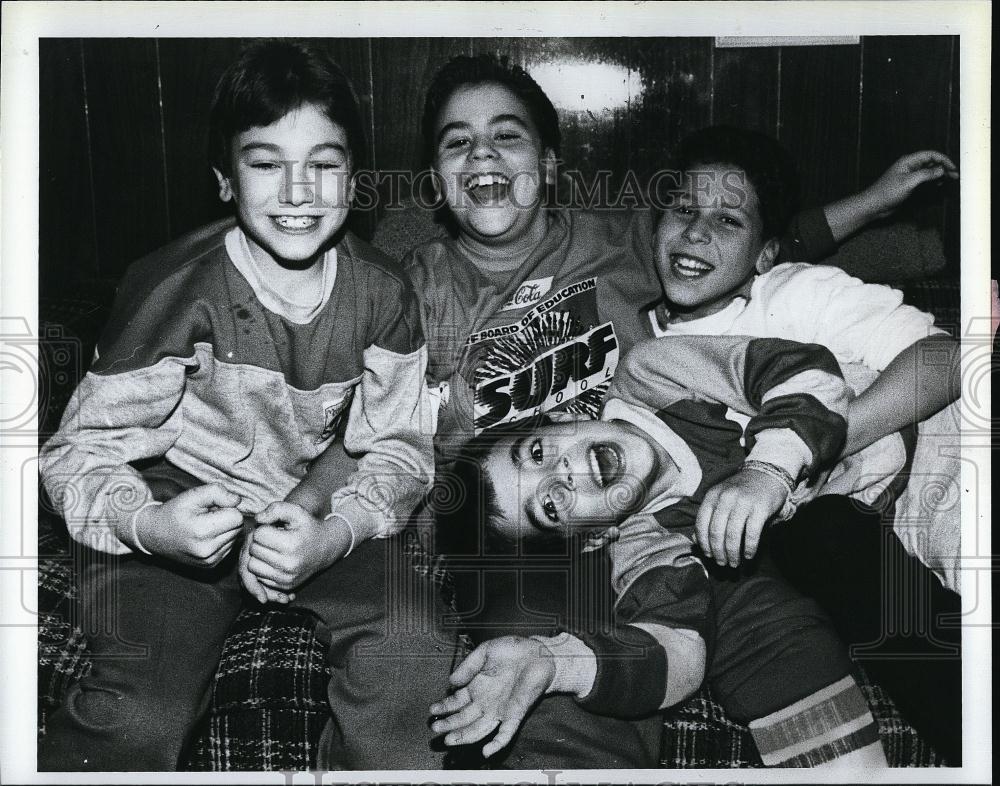 1988 Press Photo Child actor Brian Mason horsing around w/ friends - RSL89849 - Historic Images