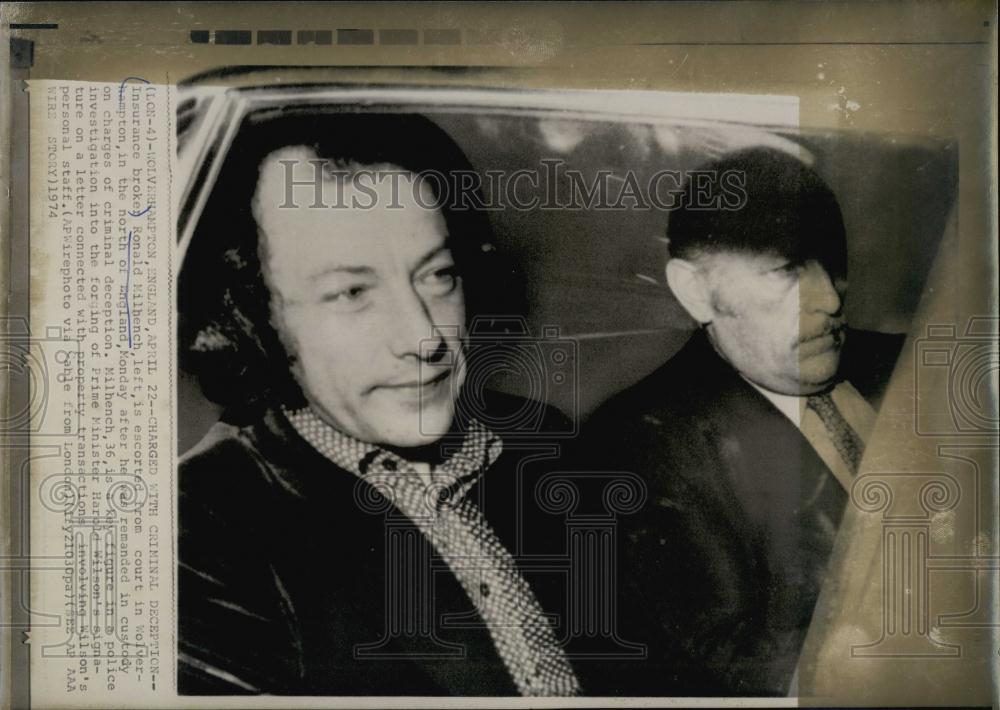 1974 Press Photo Insurance Broker Ronald Milhench Escorted from Court - Historic Images