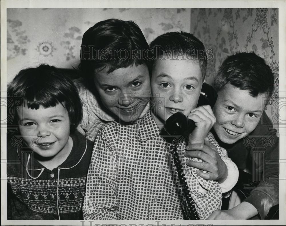1960 Press Photo Emergency call interrupted by youngster asking for play date - Historic Images
