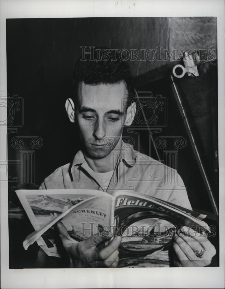 1951 Press Photo Robert Brubaker Reads In Jail After Admitting To Murder - Historic Images