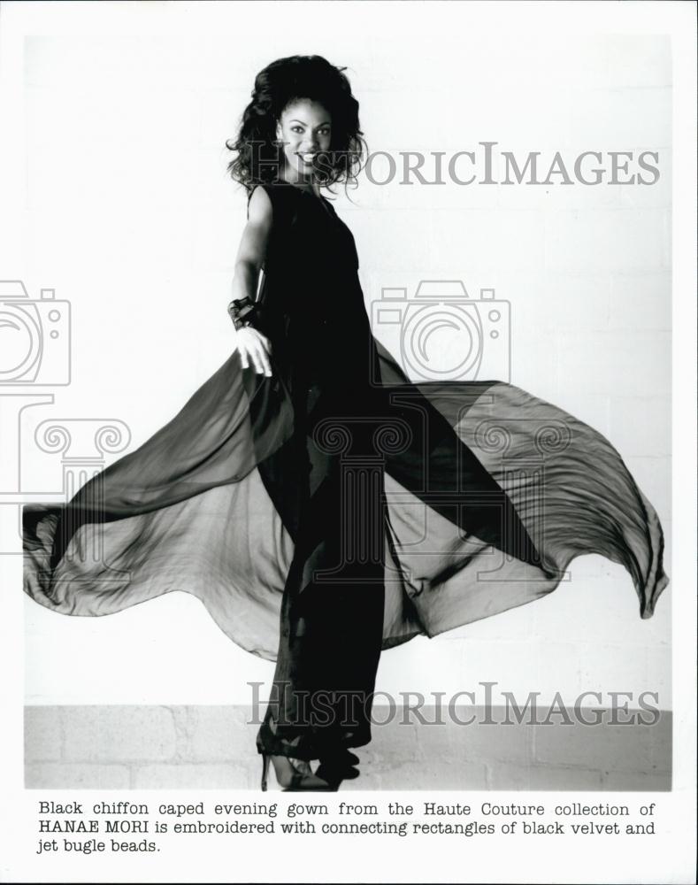 1997 Press Photo Woman Models Black Chiffon Caped Evening Gown - RSL58891 - Historic Images