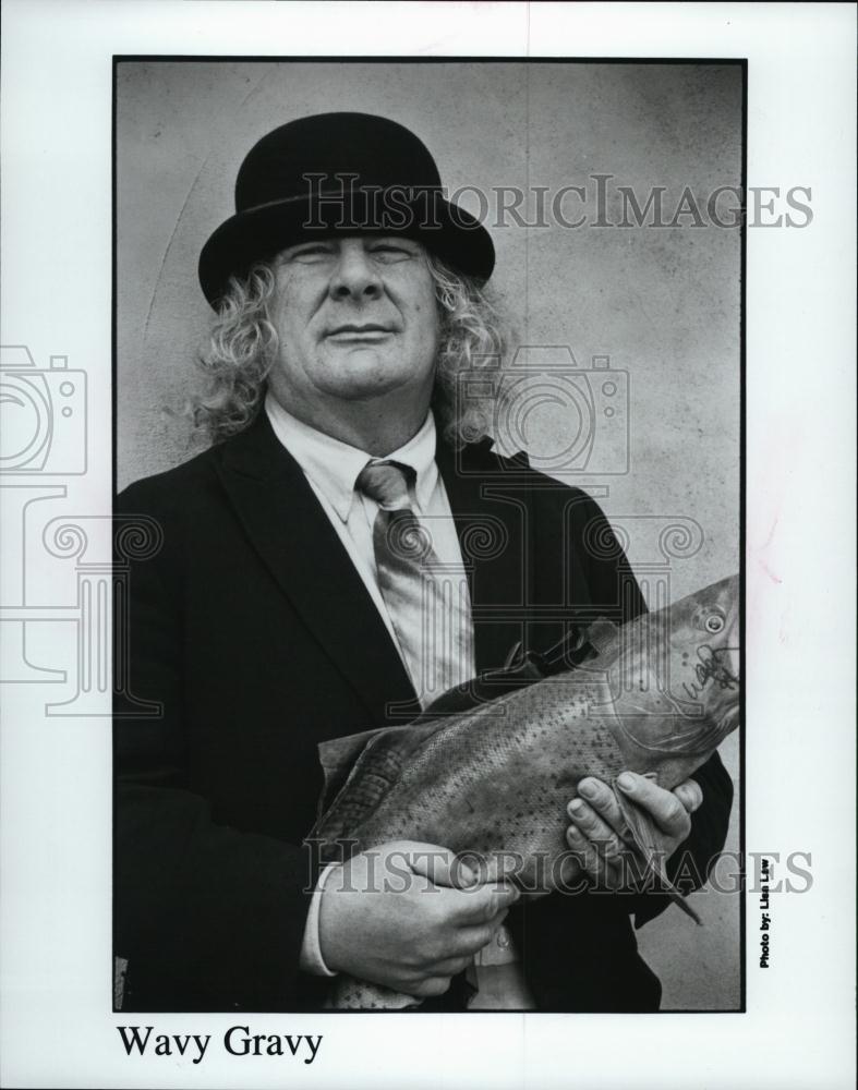 1997 Press Photo FBI Informant Wavy Gravy Holds A Fish - RSL42197 - Historic Images