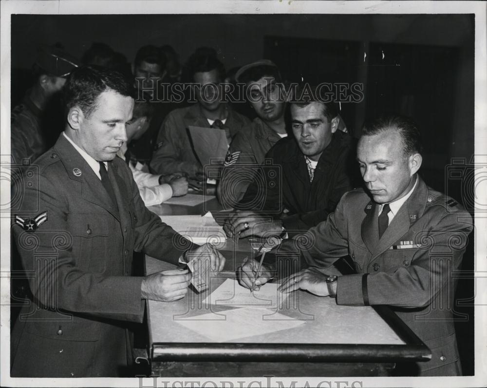 1961 Press Photo A/2C John Armstrong Checks Records Of Captain Nicholas Morello - Historic Images