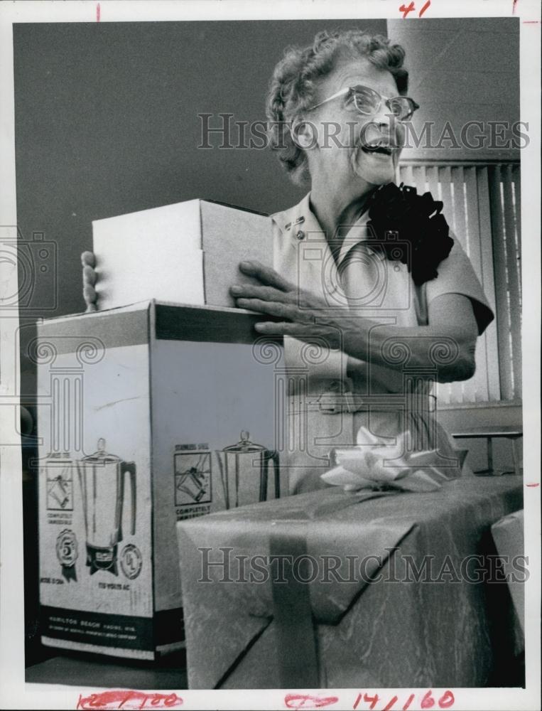 1968 Press Photo Nurse Robina Tillinghast opening her gifts - RSL62133 - Historic Images