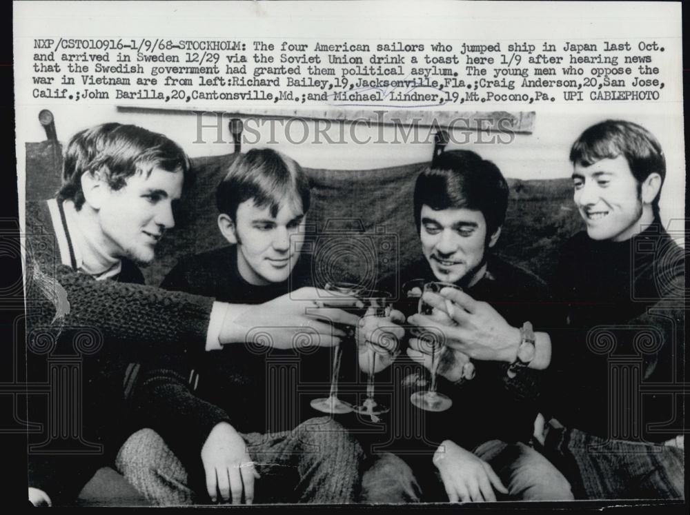 1968 Press Photo Four US Sailors jumped ship in Japan in Sweden drink a toast - Historic Images