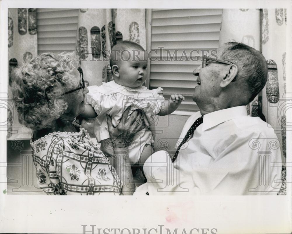 1963 Press Photo Mr &amp; MrsHarry Miller Holding Grandchild Kelly Lee - RSL69795 - Historic Images