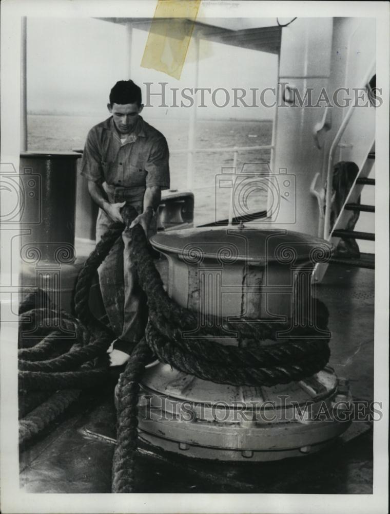 1955 Press Photo Worker Eugene Landy Works on Oil Tanker after Rejected by Navy - Historic Images