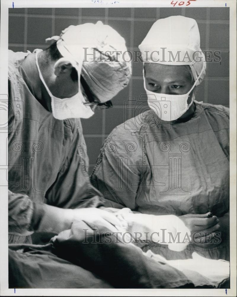 1963 Press Photo Sally Canales Runs Office, Waxes Furniture, Handles Surgery - Historic Images