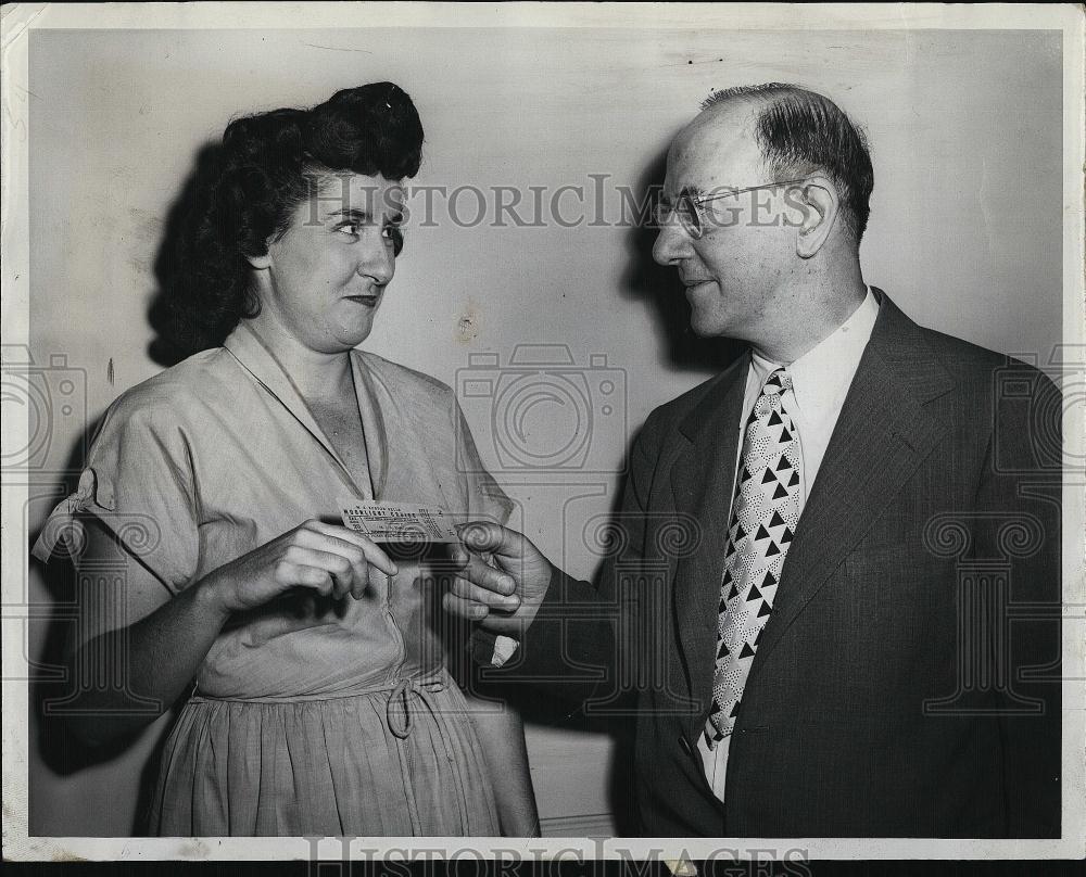 1949 Press Photo Ed Dana, GM of Boston MTA, buys moonlight cruise ticket - Historic Images
