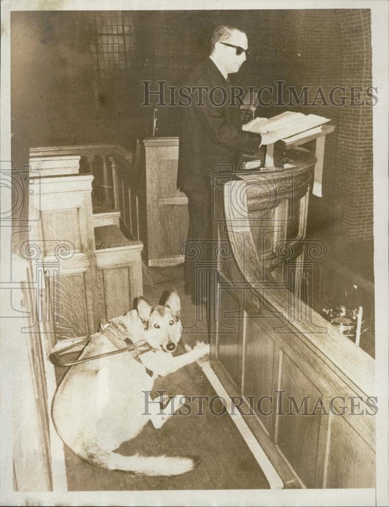 1966 Press Photo Reverand Leonard Collns reads a newspaper with dog nearby - Historic Images