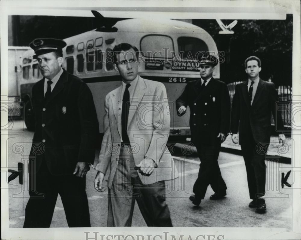 1955 Press Photo Boston Herola American walking across street - RSL07459 - Historic Images