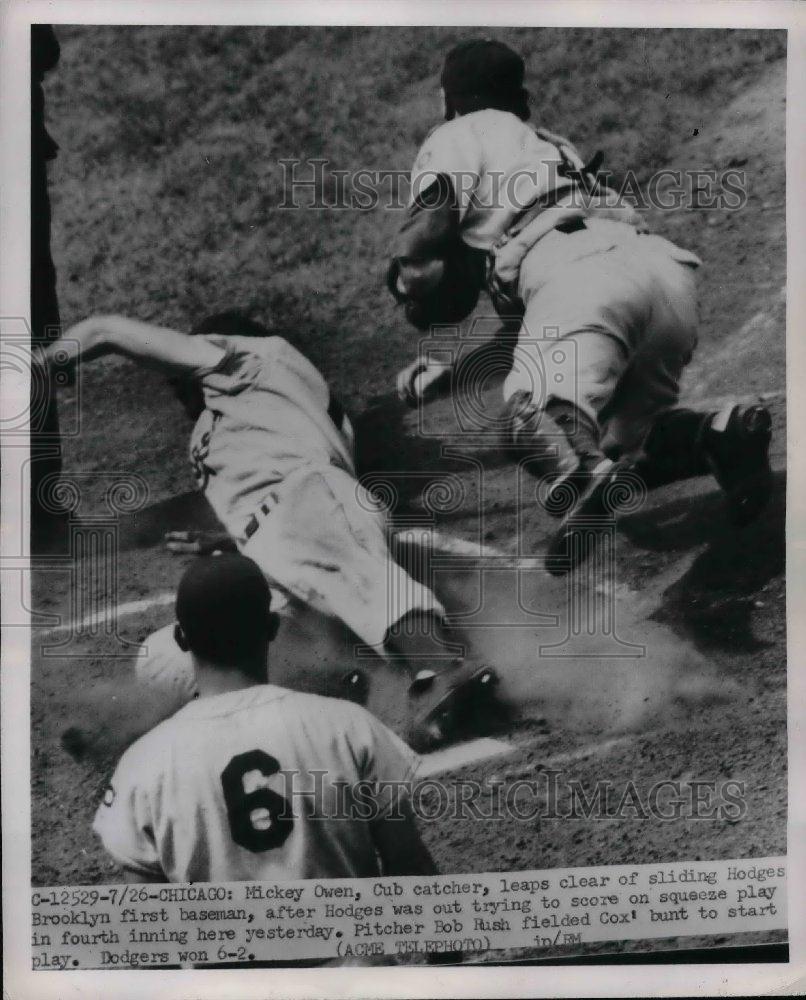 1951 Press Photo Cub Catcher Mickey Own Leaps Clear Of Dodger Hodges - Historic Images