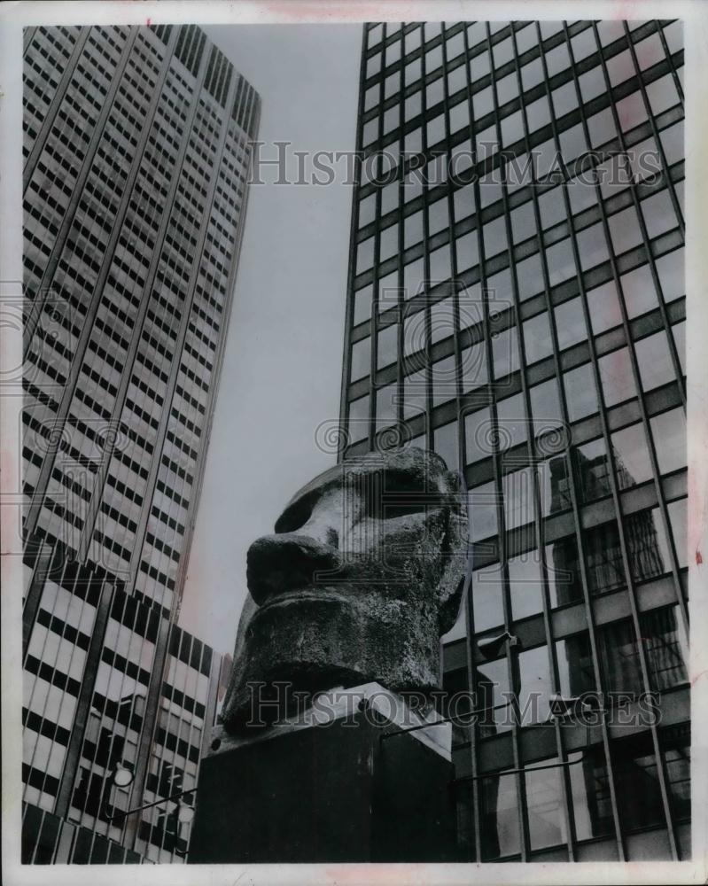 Press Photo Mask Monument in front of tower Buildings Statue - nea11224 - Historic Images