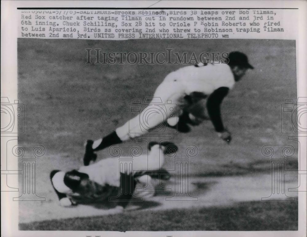 1963 Press Photo Orioles Brooks Robinson Leaps Over Bob Tilman Red Sox - Historic Images