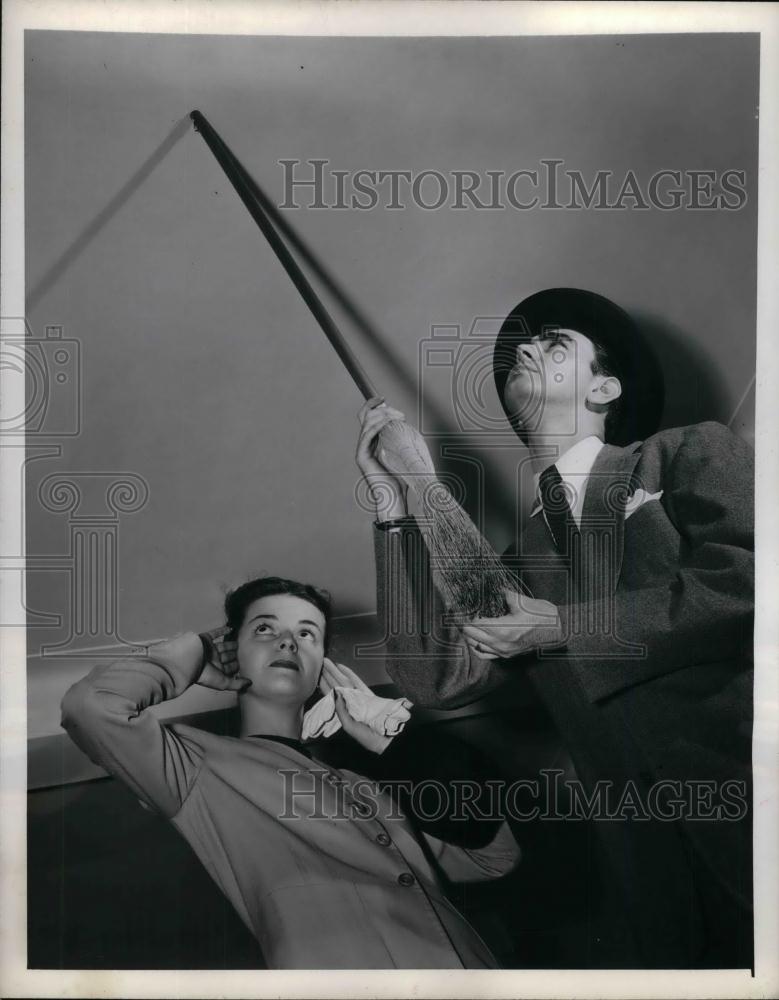1945 Press Photo Men check plaster on a ceiling with a broomstick - Historic Images
