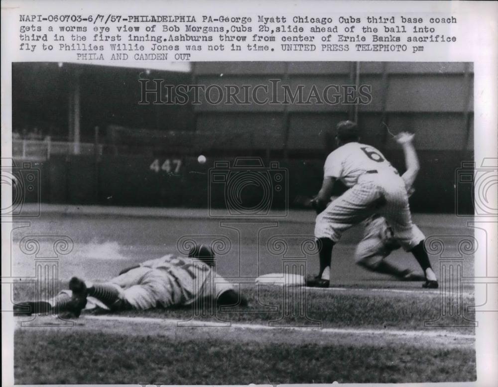 1957 Press Photo Cubs&#39; coach George Myatt getting worm&#39;s eye view of slide - Historic Images