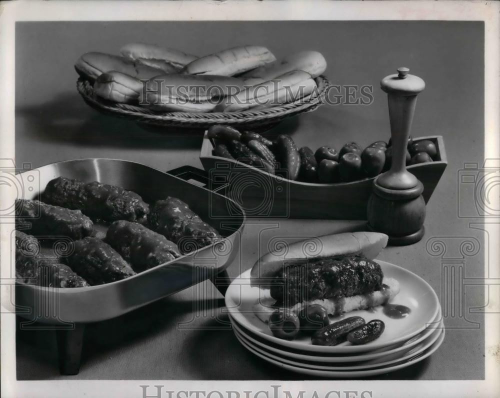 1962 Press Photo A picnic spread, hot dogs, pickles,hamburgers - nea25415 - Historic Images