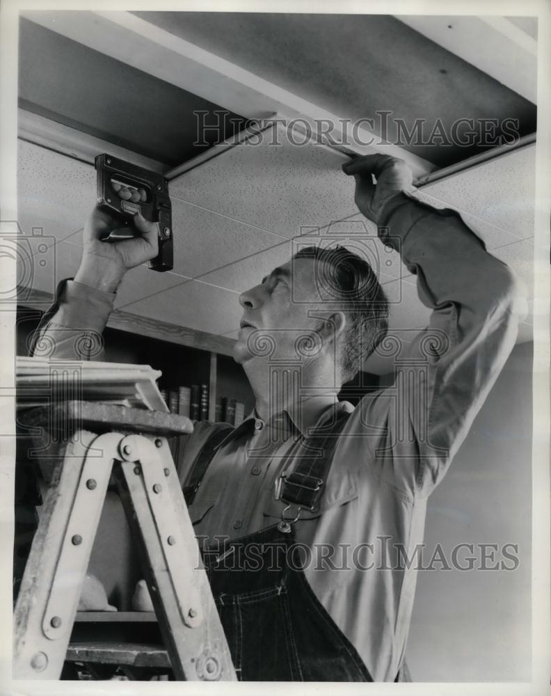 Press Photo Man Repairing Sagging/Badly Damaged Ceiling - nea22239 - Historic Images