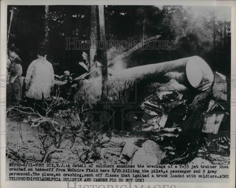1951 Press Photo Soldier Examine wreckage of T-33 Jet crashed from McGuire Field - Historic Images