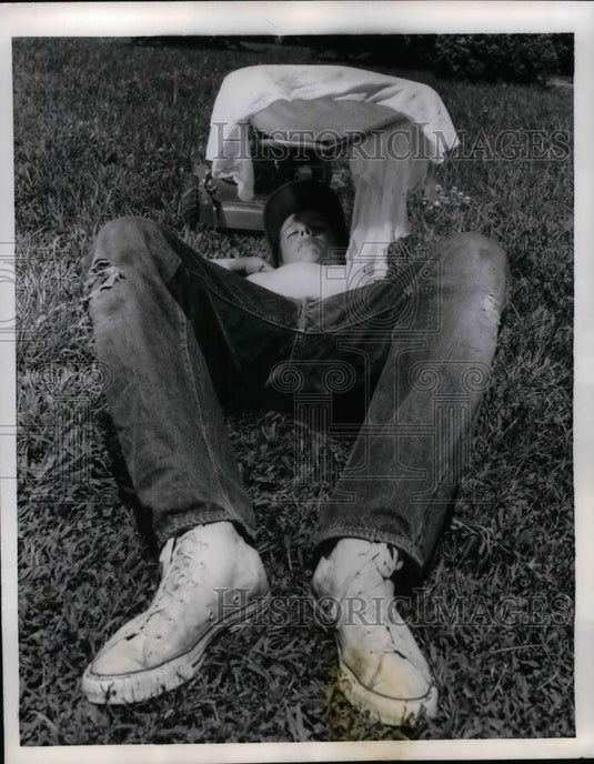 1958 Press Photo young Gary McGirr resting from mowing yard, Topeka, KS - Historic Images