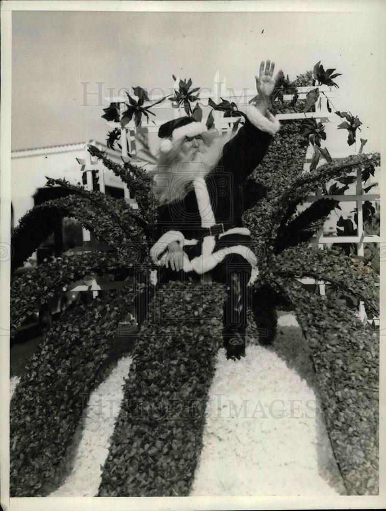1935 Press Photo Santa Claus on Giant Poinsetta Parade Float, Miami, Florida - Historic Images