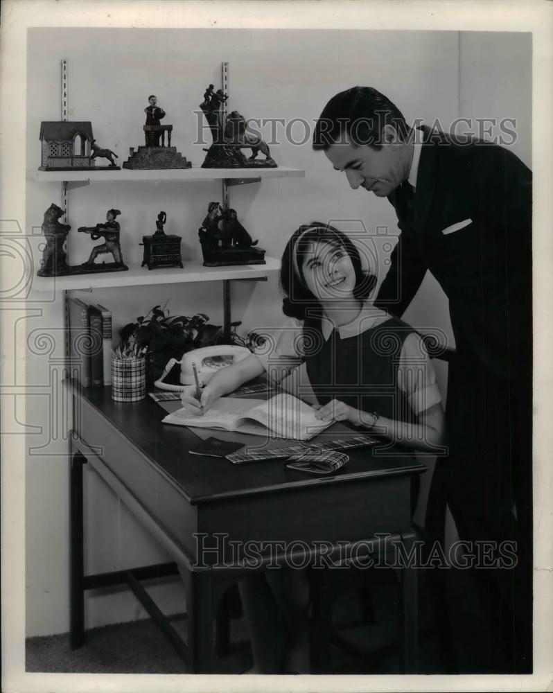 1963 Press Photo Father Overlooks Student Daughter Doing Homework - nea19312 - Historic Images