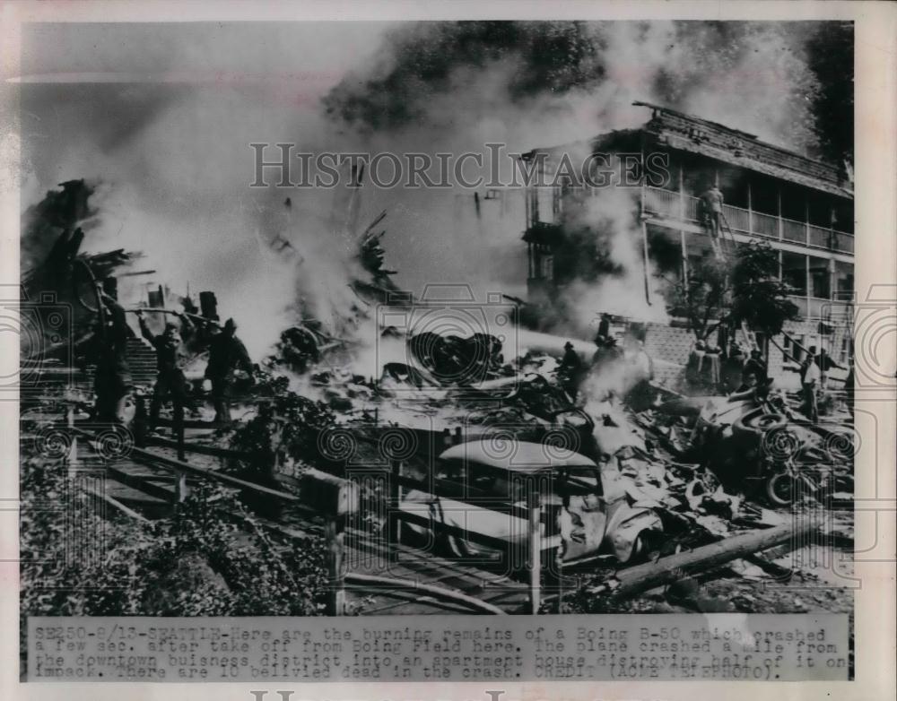 1951 Press Photo Boing B-50 crashed at downtown Business into Apert. at Seattle. - Historic Images