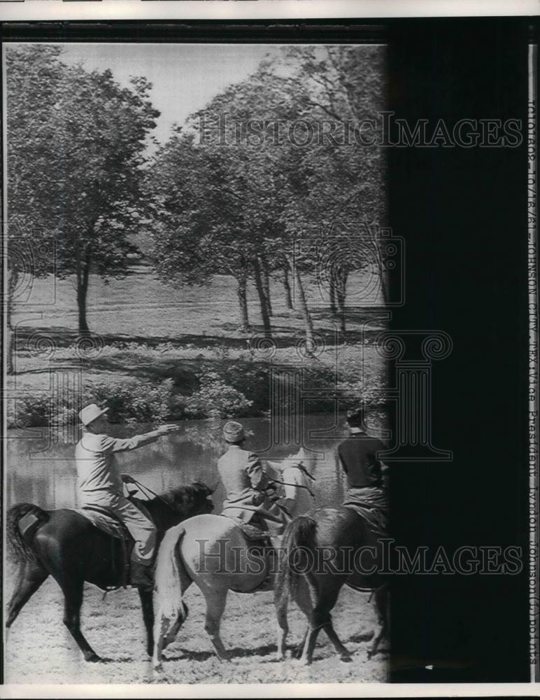 1961 Press Photo Men on Horseback Beside River - nea19671 - Historic Images